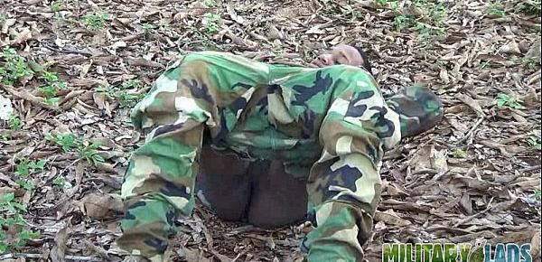  Army boy strokes his wood in the woods